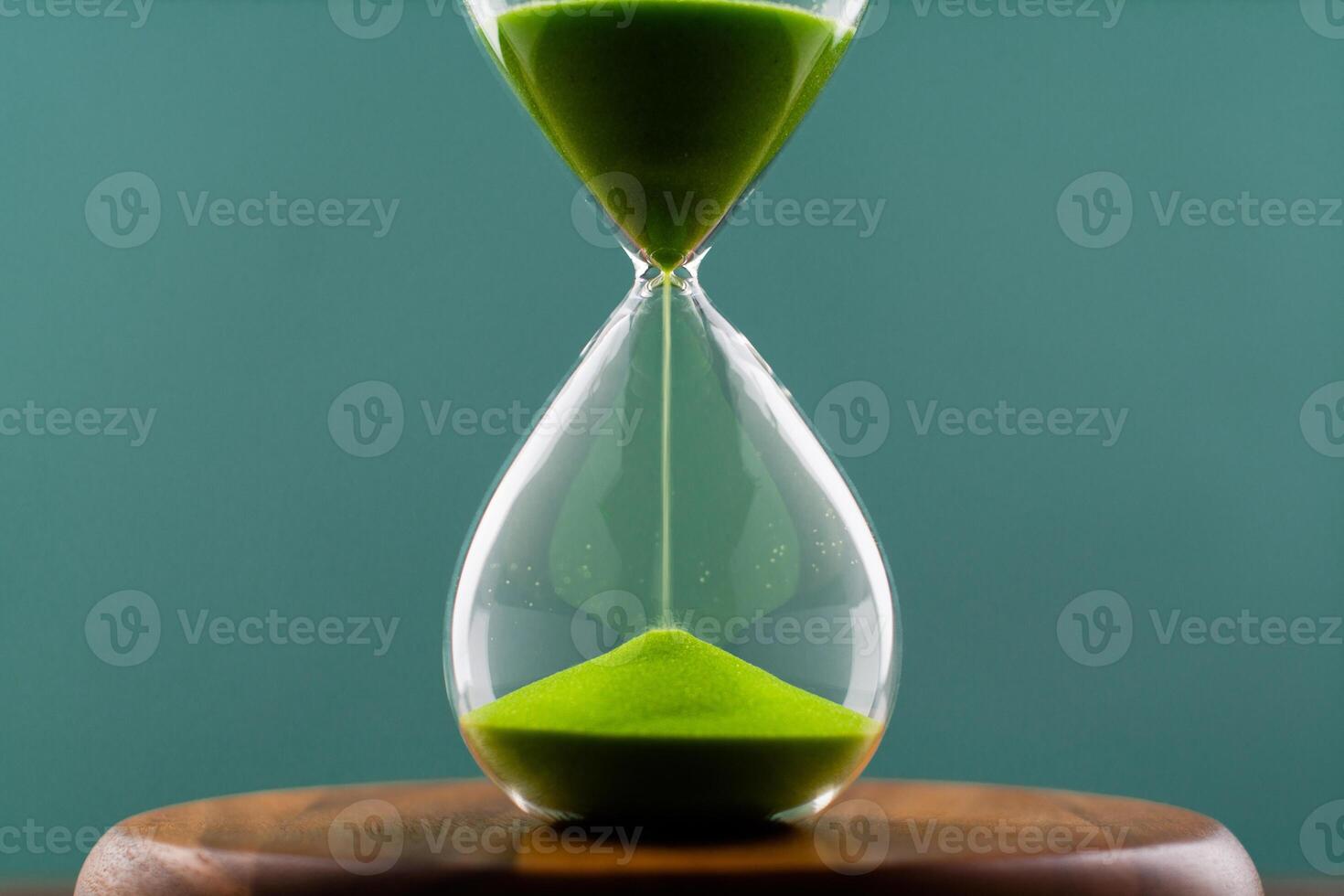 Hourglass is a process of counting down time. Limited time for work. photo