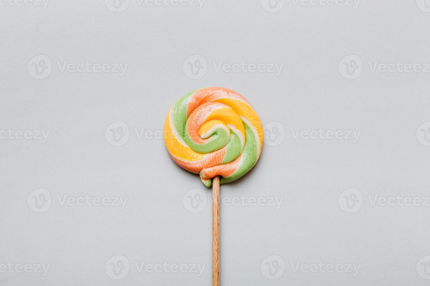 Colorful candies, lollypop on the colorful background, multicolored minimal style top view photo