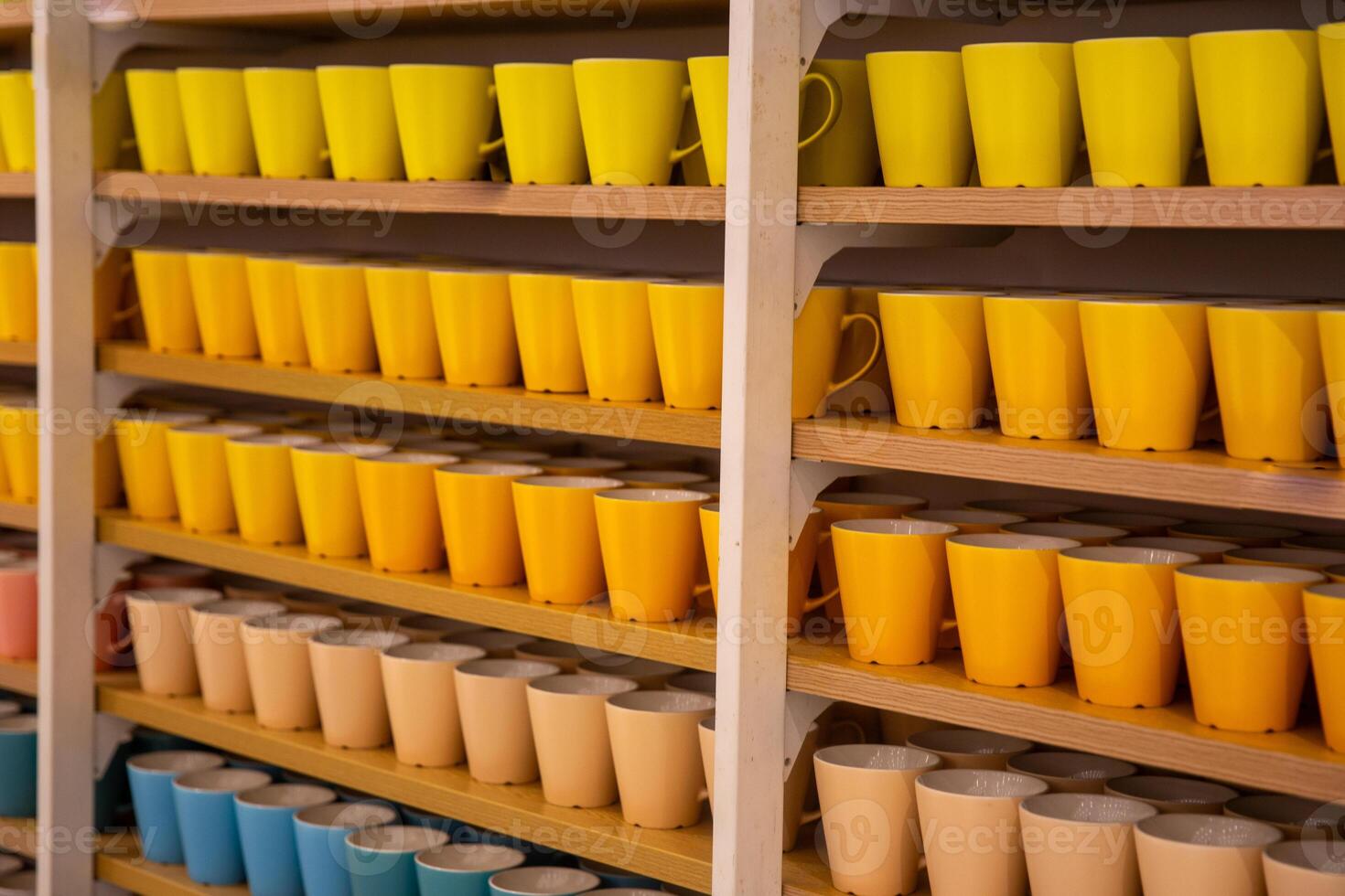 A shelf with many cups on it photo