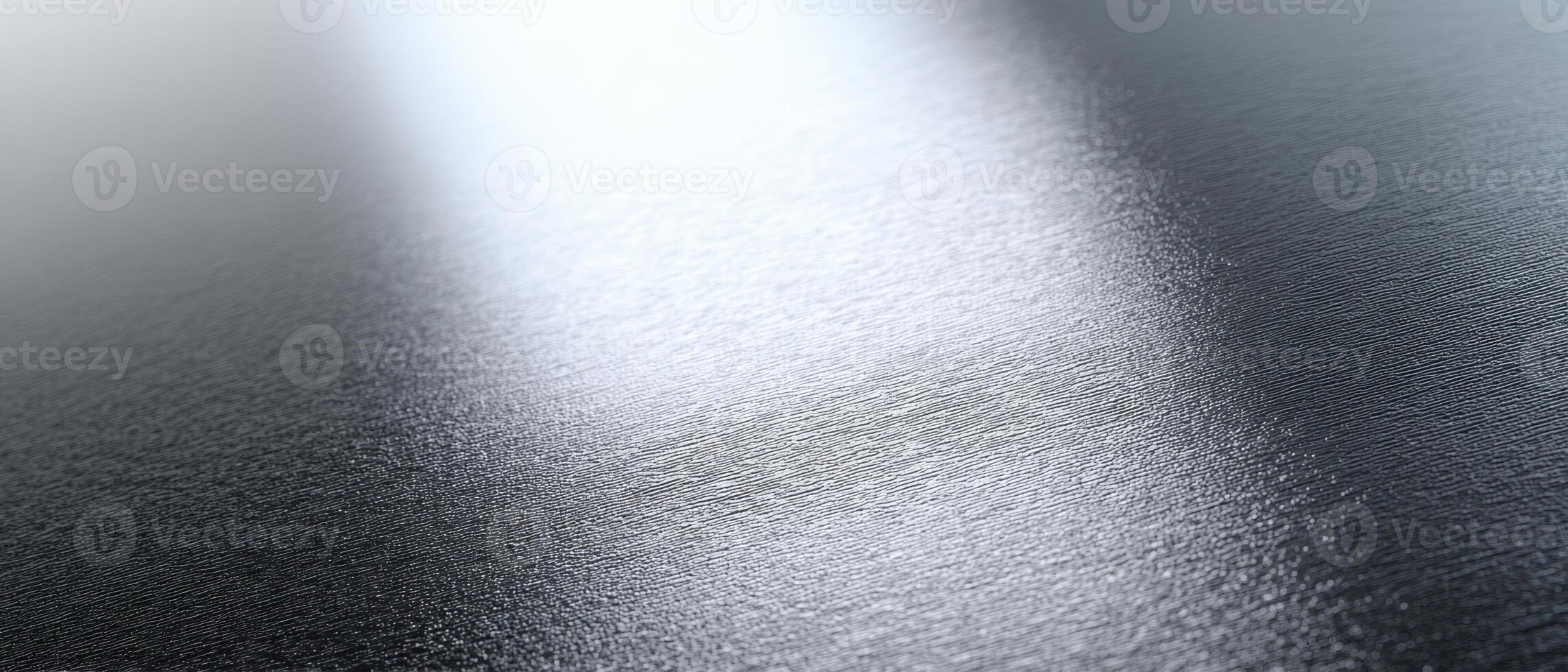 The metallic surface reflecting light and creating abstract patterns. photo