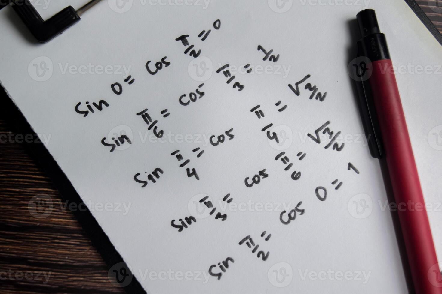 Concept of similar trigonometric functions write on book isolated on Wooden Table. photo
