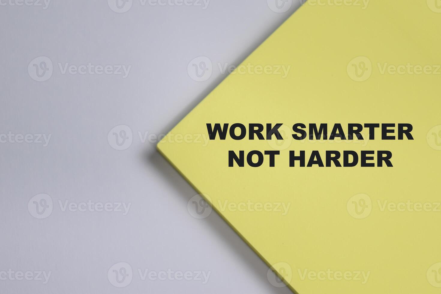 Concept of Work smarter not harder write on sticky notes isolated on Wooden Table. photo