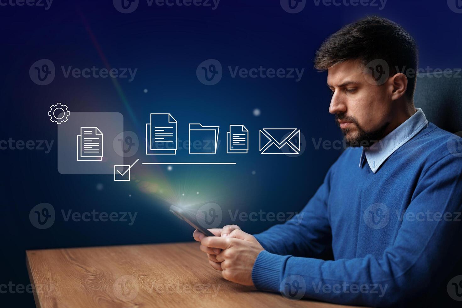Efficient digital organization by a man using a smartphone in a modern office environment at night photo