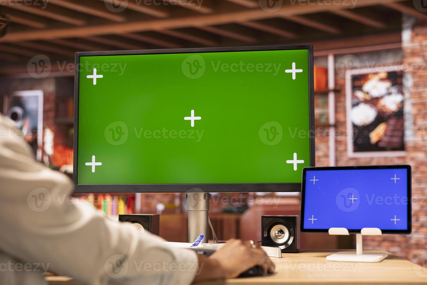 Student at home desk browsing websites on isolated screen computer and tablet, doing homework. Close up of woman in apartment reading articles on chroma key PC and mockup device for school tasks photo