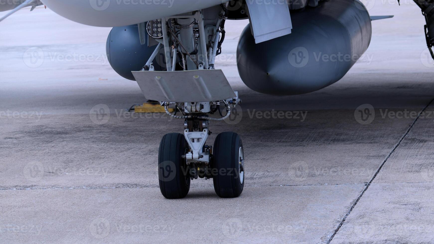 Close up of modern aircraft military fighter jet. Close up Jet parts such as landing gear engine nacelles weapon pods and cockpit with visible pilots showing defense technology and aircraft design photo
