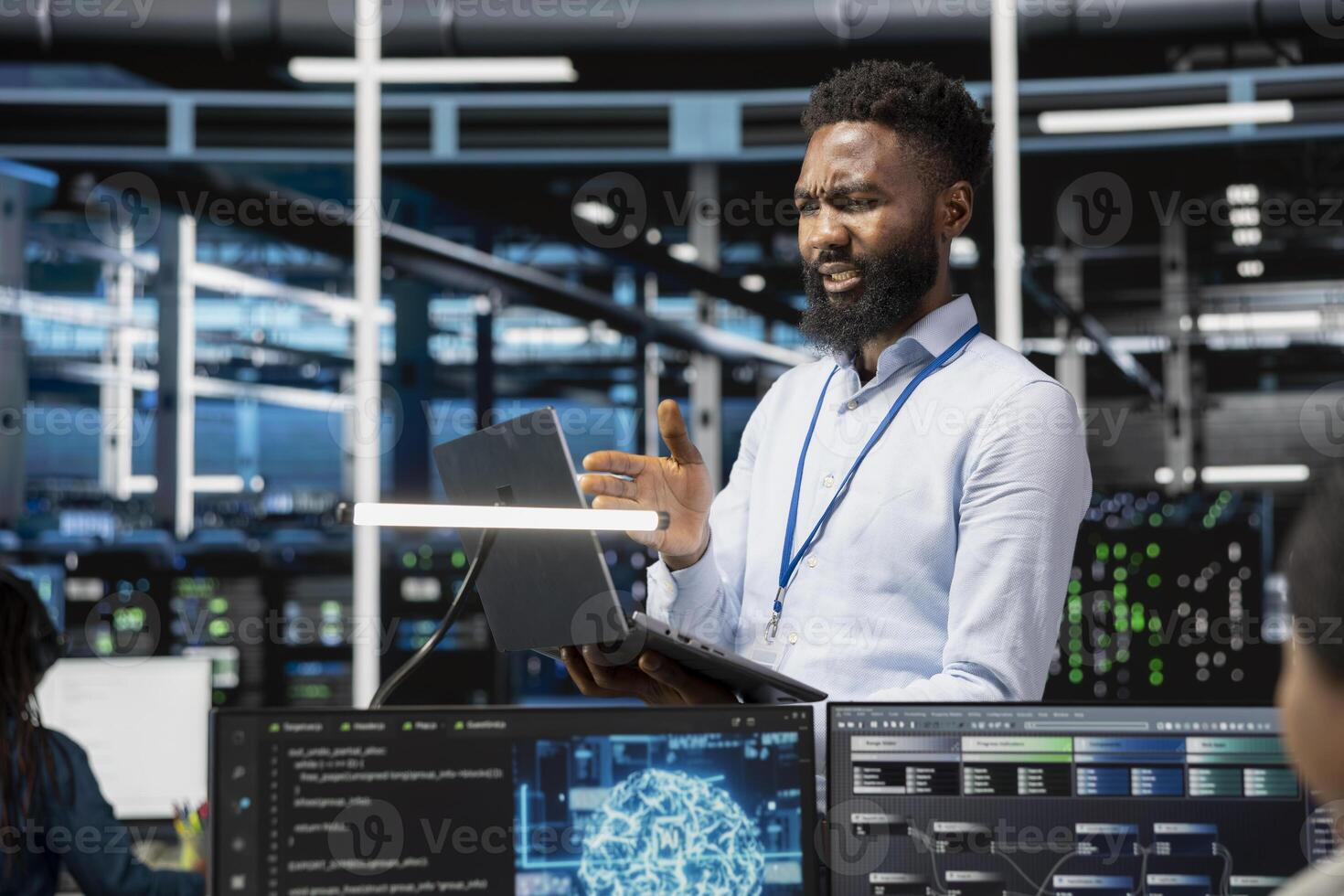 Admin in data center using artificial intelligence computerized model perplexed by glitches affecting equipment. Frowning server room employee upset by broken AI machine learning algorithms photo