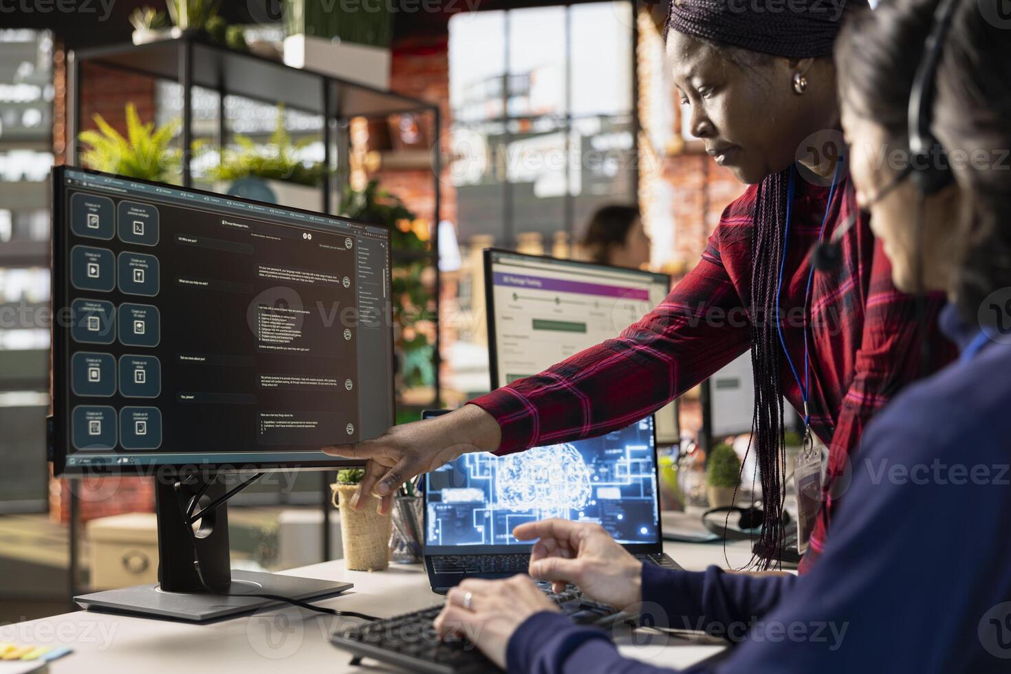 Call center manager providing guidance to new recruit on how to use AI chatbot at work. Customer support workplace onboarding specialist teaching new employee to use AI LLM assistant photo
