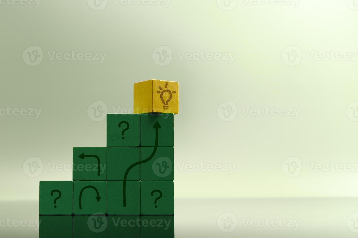 Staircase of green blocks with question marks leads to yellow cube symbolizing a solution, problem-solving, innovation and economic recovery photo