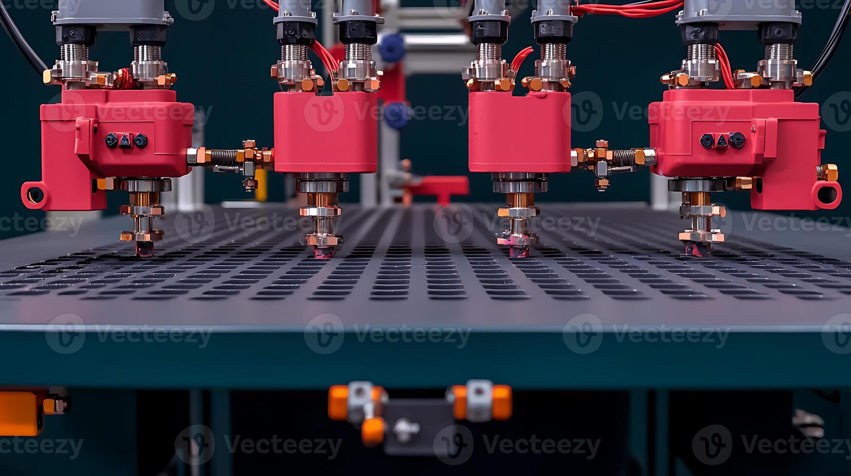 Precision machinery with multiple nozzles working on a perforated surface in a high-tech environment photo