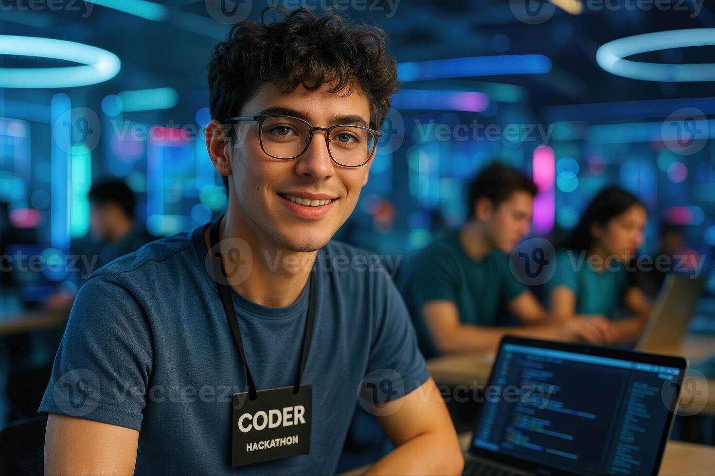 Young Coder at Hackathon Wearing Glasses and Badge in Vibrant Tech Workshop Setting photo