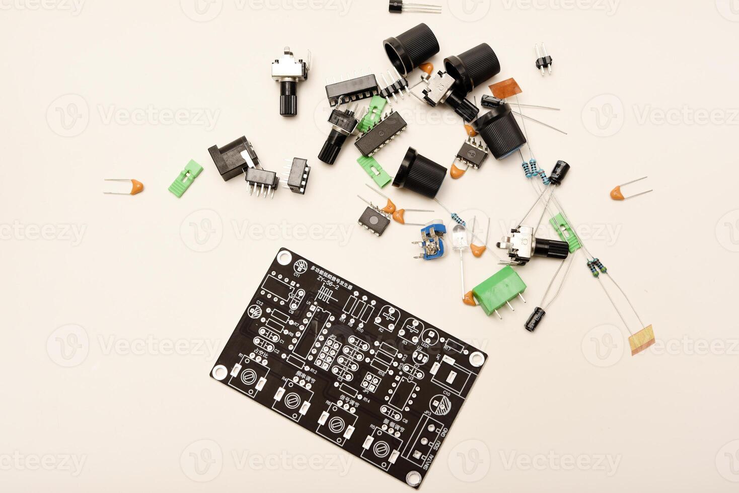 A complete DIY electronics kit for assembling a functional radio device, featuring diverse radio components and a printed circuit board. photo