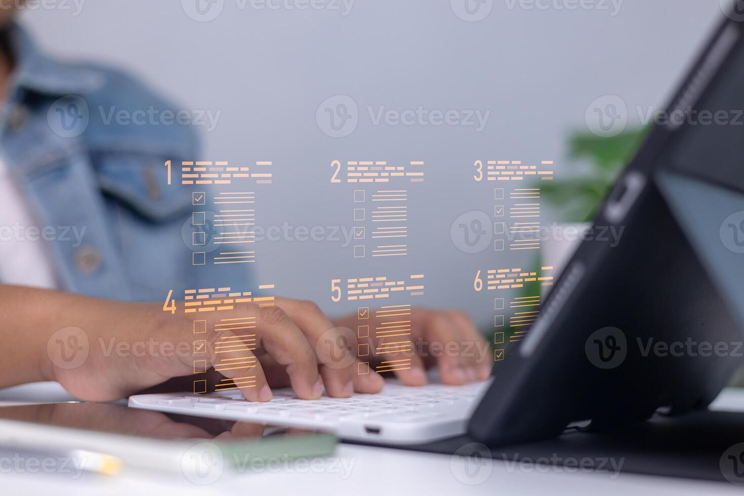 Person using a digital checklist on virtual screen while typing on keyboard, representing productivity, task management, and modern office workflow with technology. photo