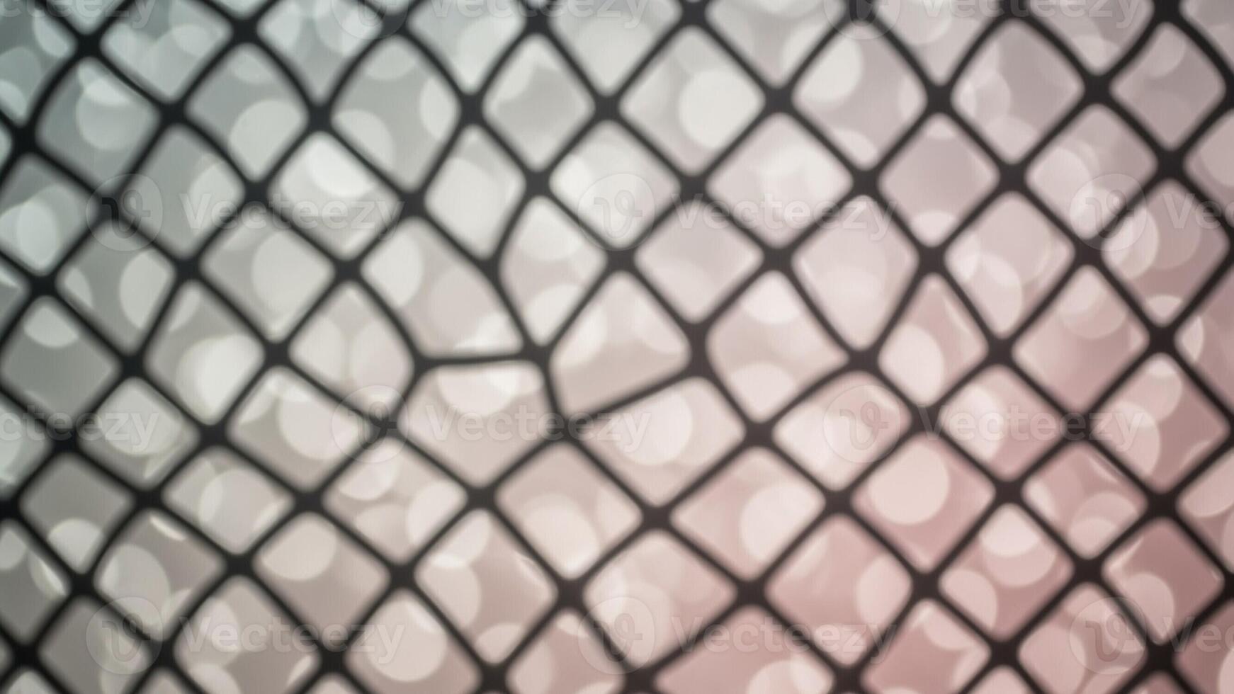 A close up of a net with a blurred background photo
