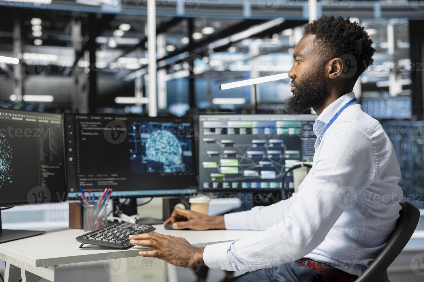 Computer scientist inspecting neural network data center used for machine learning. African american man doing maintenance on server hub to optimize it for artificial intelligence workloads photo