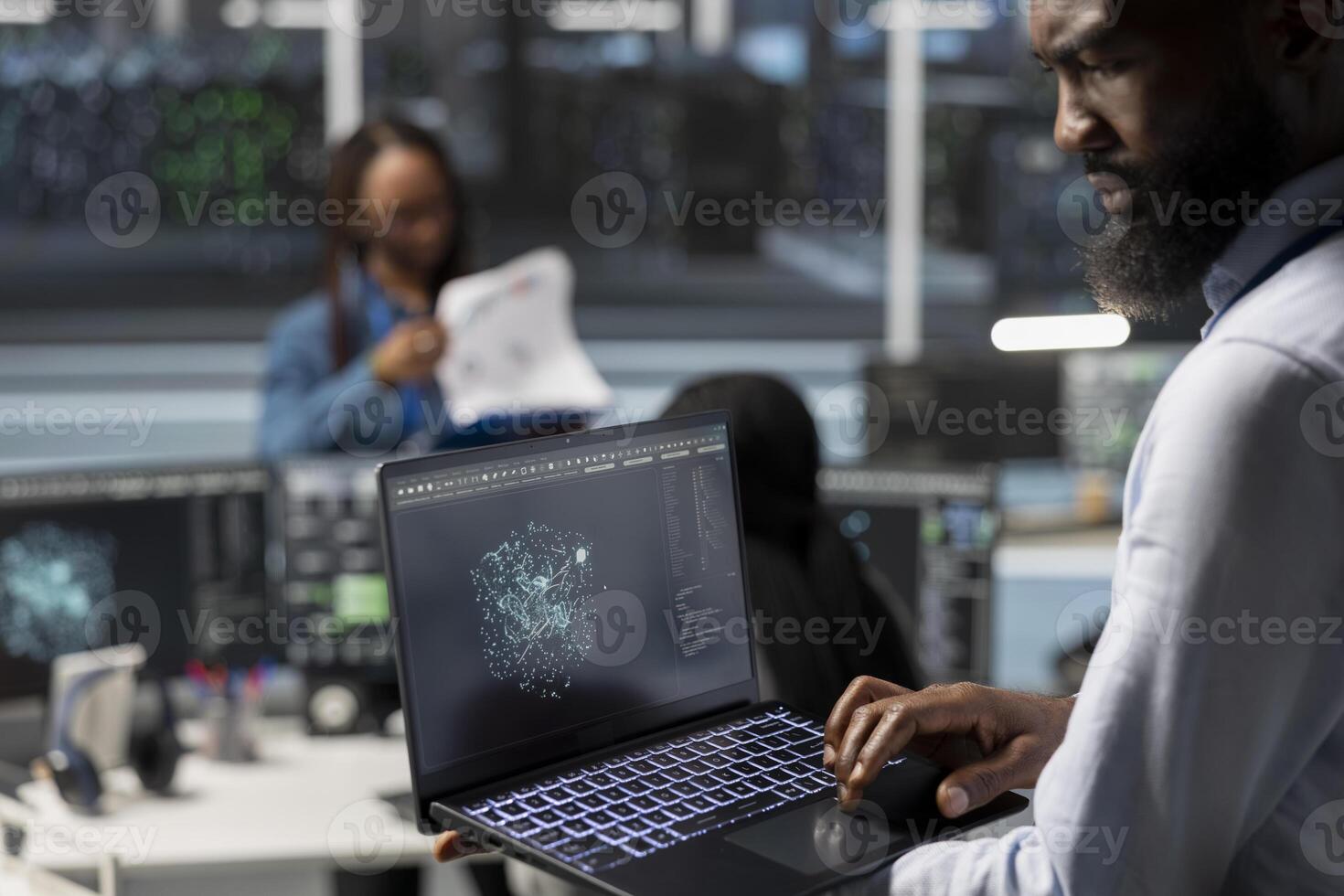 Data center admin using artificial intelligence visualization tools on laptop to identify equipment errors. Server hub worker looking at insights on notebook to detect hardware failures photo