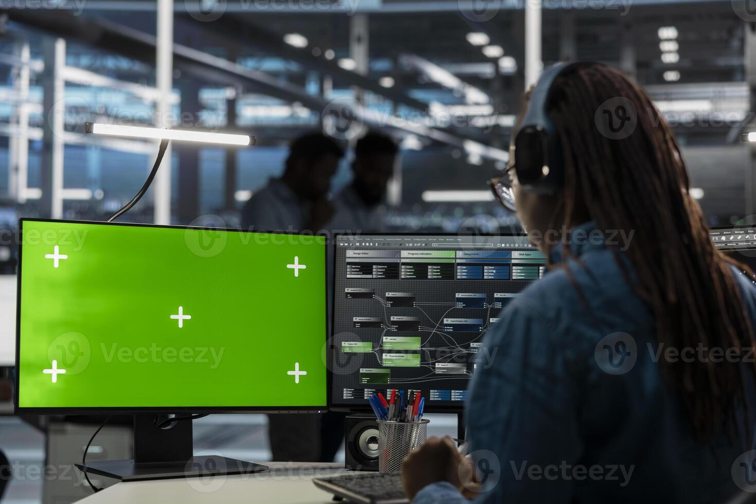 System administrator in server farm using isolated screen PC to repair equipment storing datasets. IT expert using chroma key computer to do debugging on rigs doing computational operations photo
