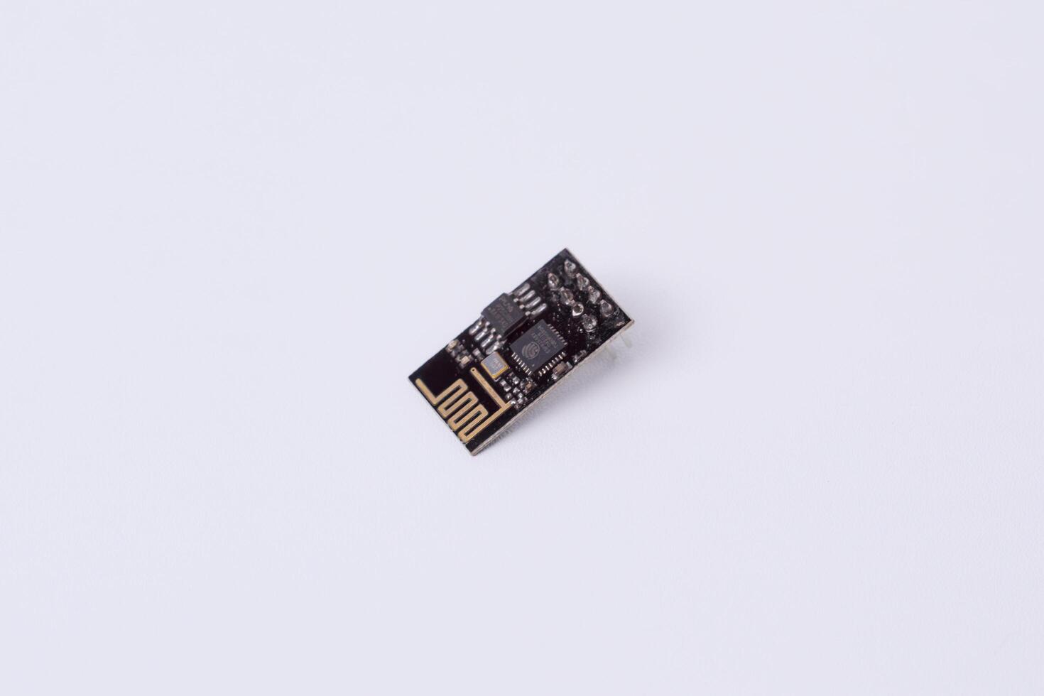 Malang, March 24, 2025. Side view of ESP8266 WiFi module on white background. Internet of Things component, wireless communication, automation, microcontroller, electronics projects. photo