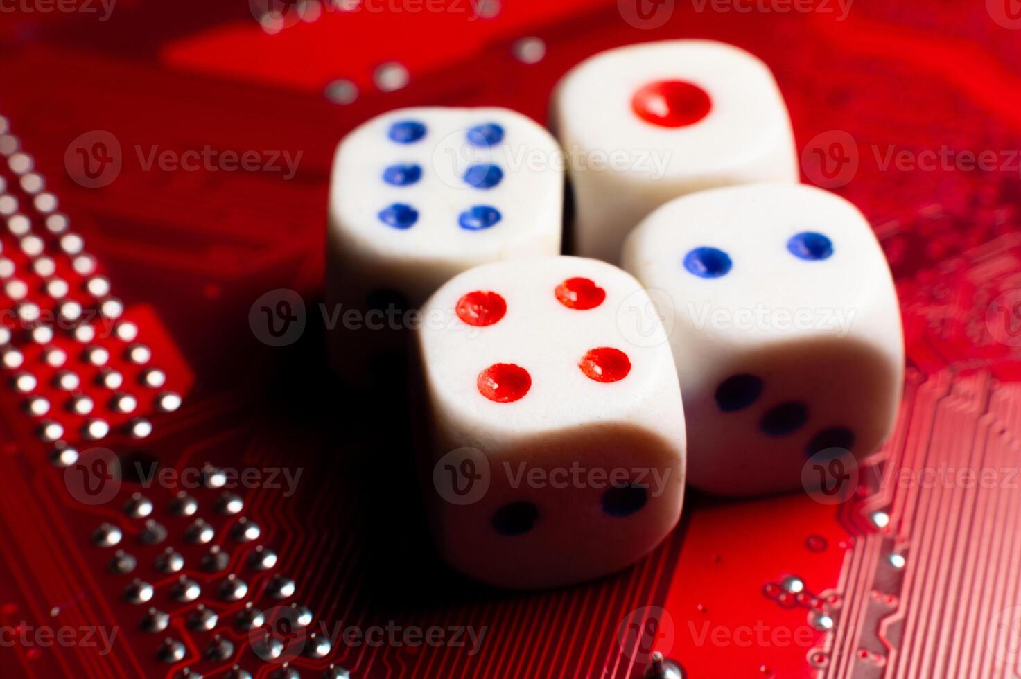 Electronic red printed circuit board with dice, top view of computer chip, selective focus. Concept of microprocessors, microchips, printed electronic circuits, technology, cyber security photo