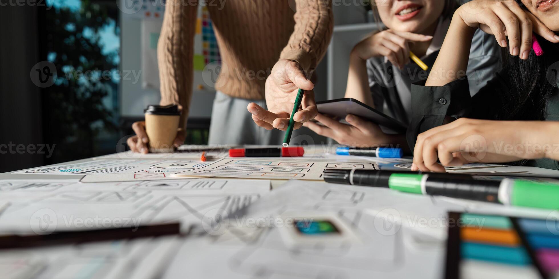 Creative UX UI Brainstorming Session with Designers Collaborating on Innovative Digital Solutions and User Experience Enhancements photo