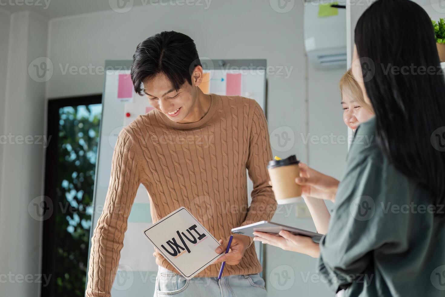 Creative UX UI Design Team Brainstorming Session with Digital Devices and Collaborative Ideas photo