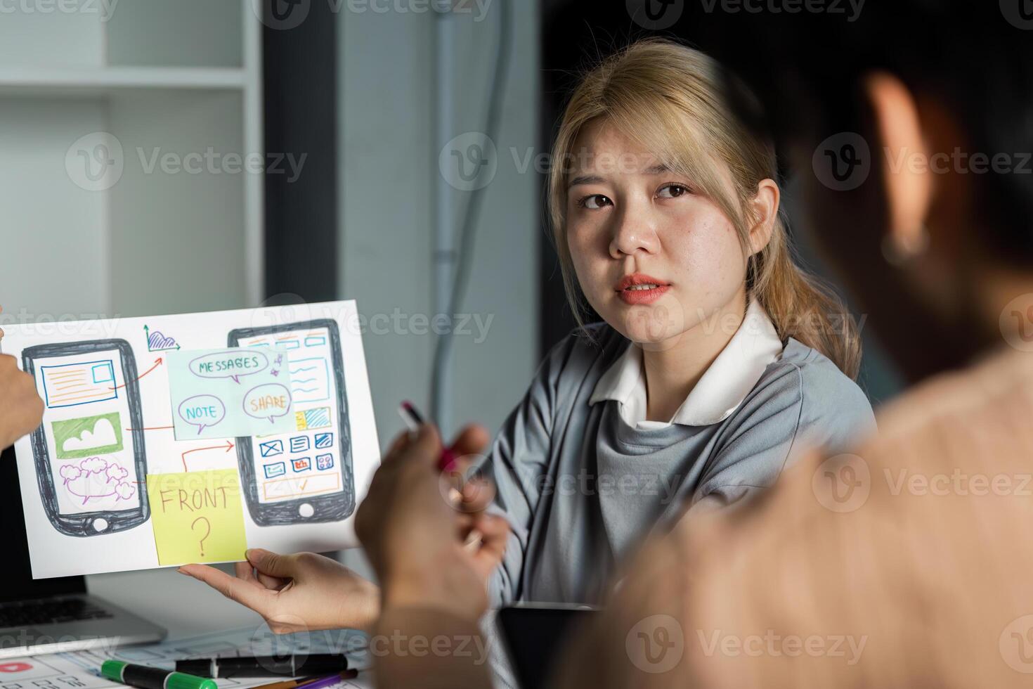 Creative UX UI Design Brainstorm Session with Diverse Team Collaborating on Innovative Mobile App Interface Concepts photo