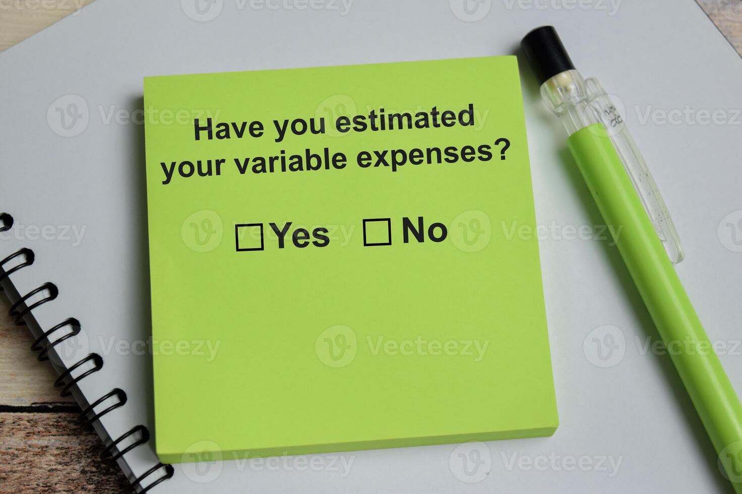 Have you estimated your variable expenses write on sticky notes isolated on Wooden Table. A person is answering question concept photo