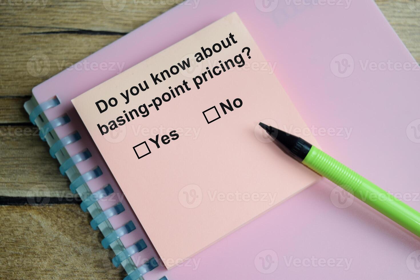 Do you know about basing-point pricing write on sticky notes isolated on Wooden Table. A person is answering question concept photo