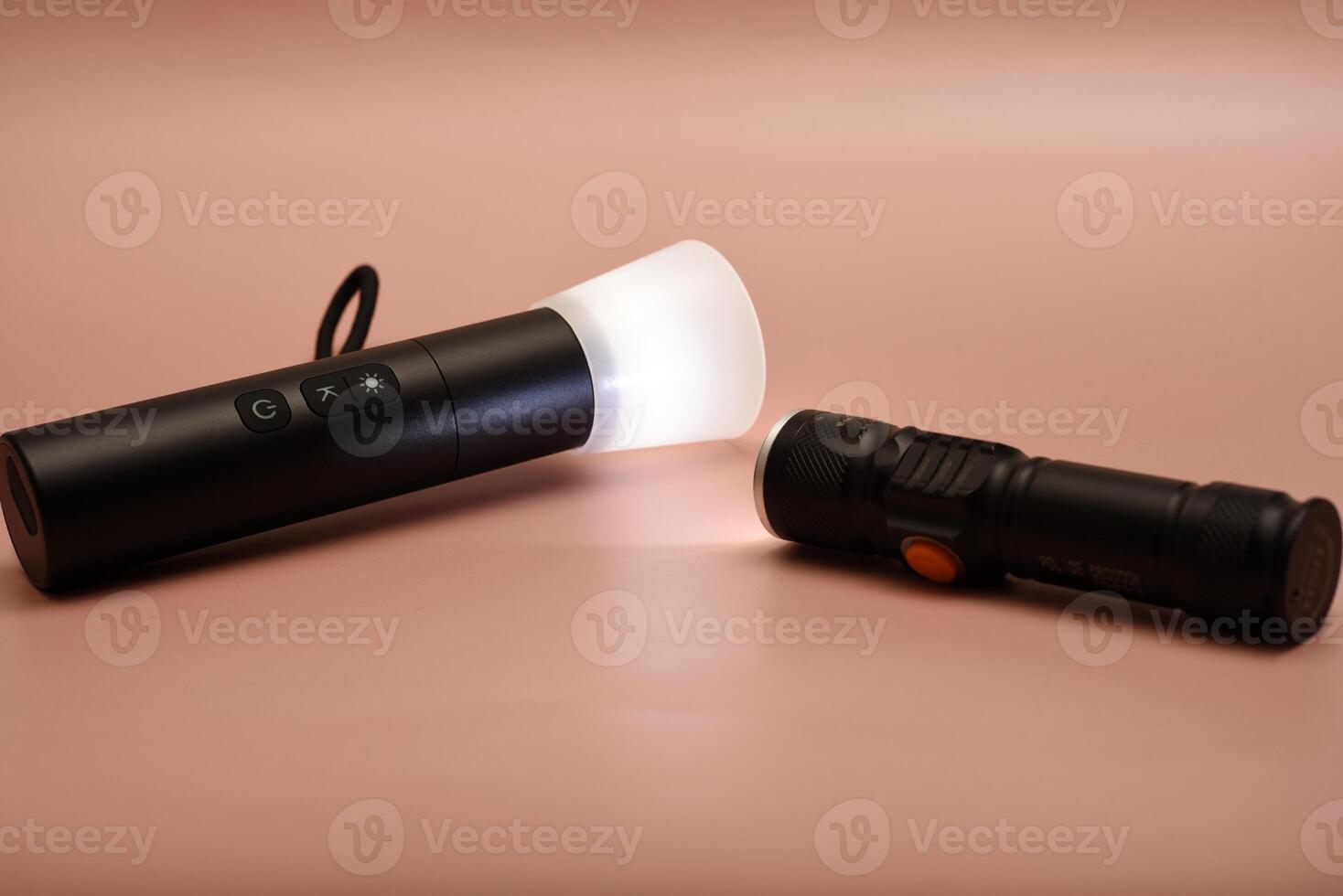 Flashlight with zoom lens function. Technical and functional. Displayed on an industrial metal surface. photo