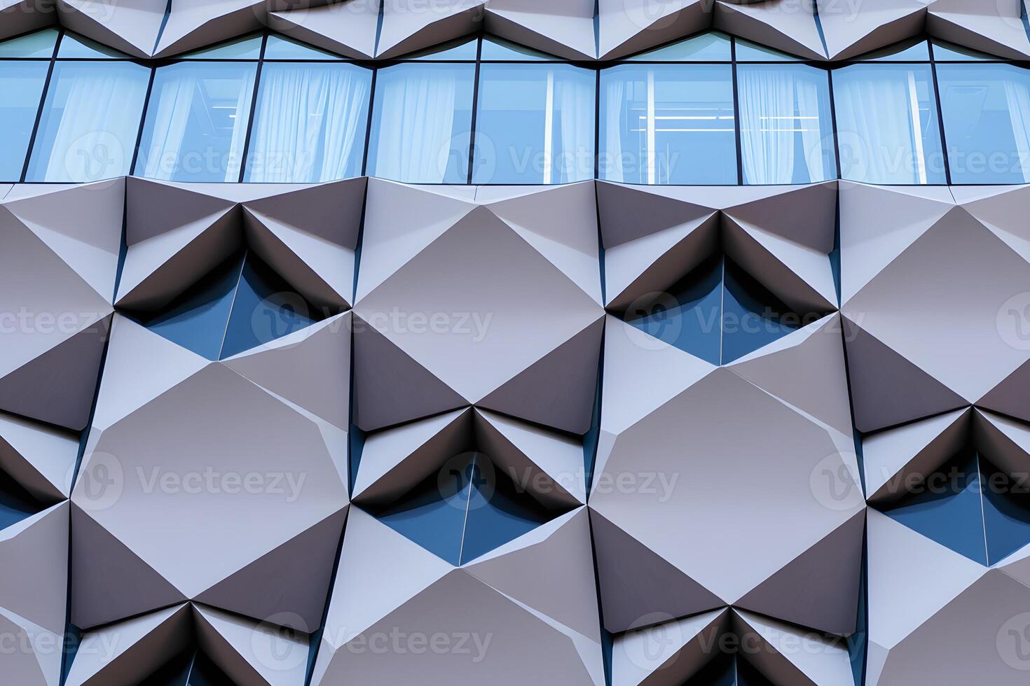 A building with a large window and a large triangular pattern photo