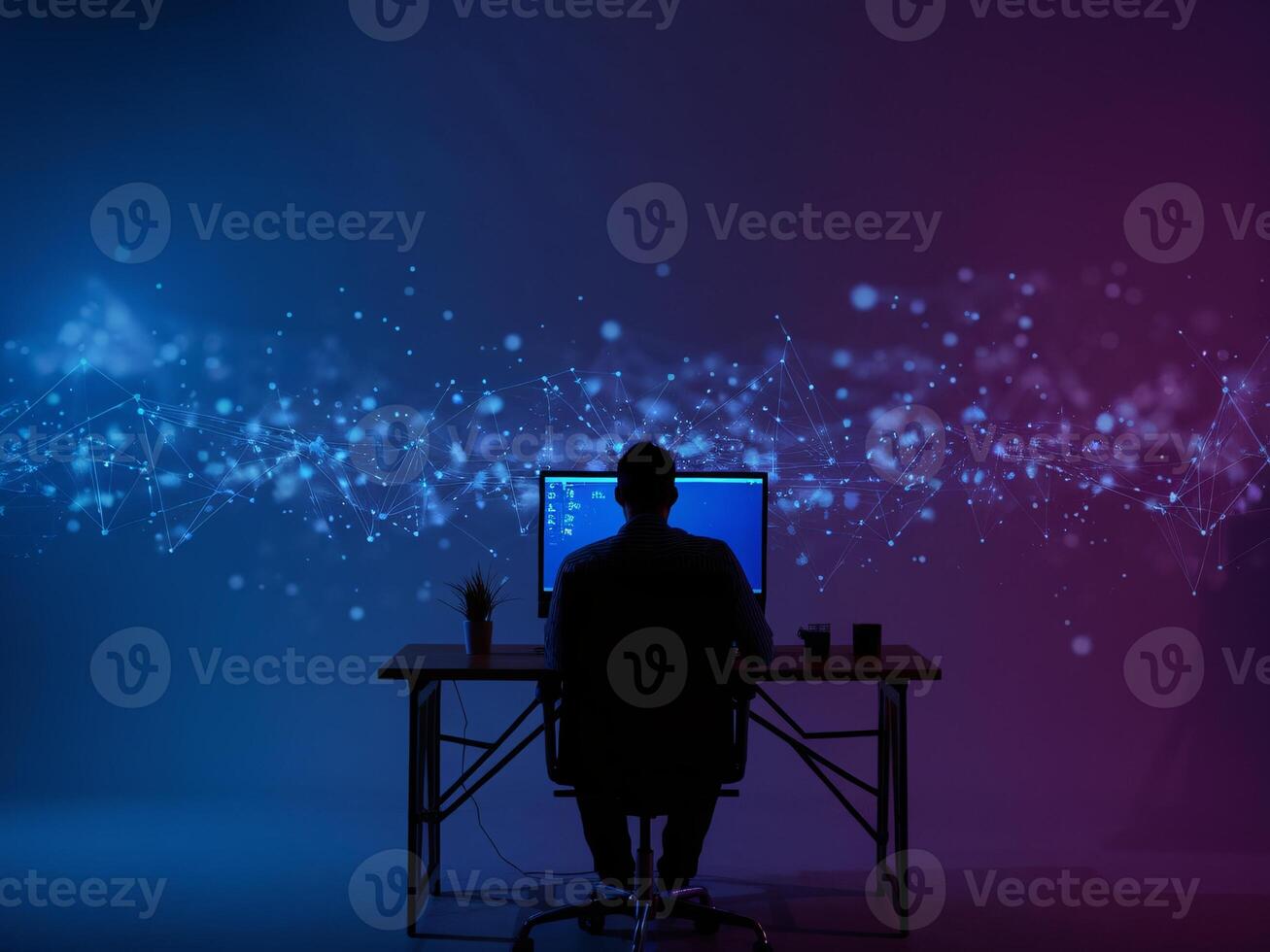 Silhouette of a man working at a computer with abstract digital lights in the background. photo