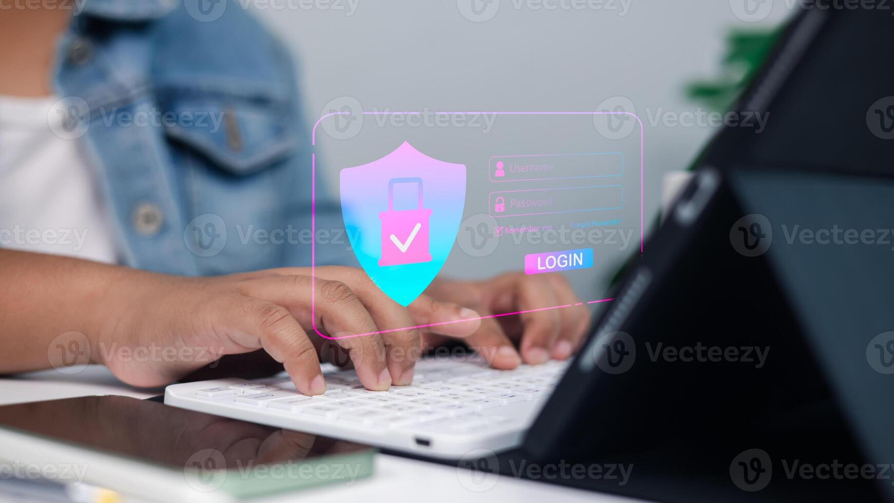 Online security, data protection, and safe access in a professional setting.Close-up of hands typing on keyboard with digital shield and padlock overlay. photo