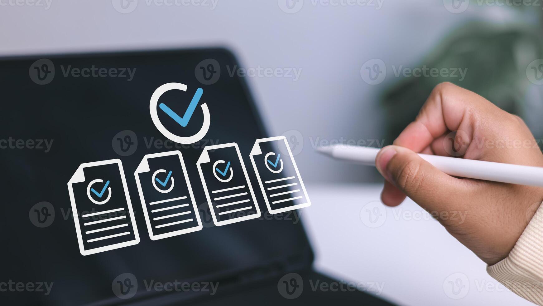 Quality control, task completion, and successful audit in modern workflow. Hand holding stylus pen pointing to digital screen with documents and check marks. photo