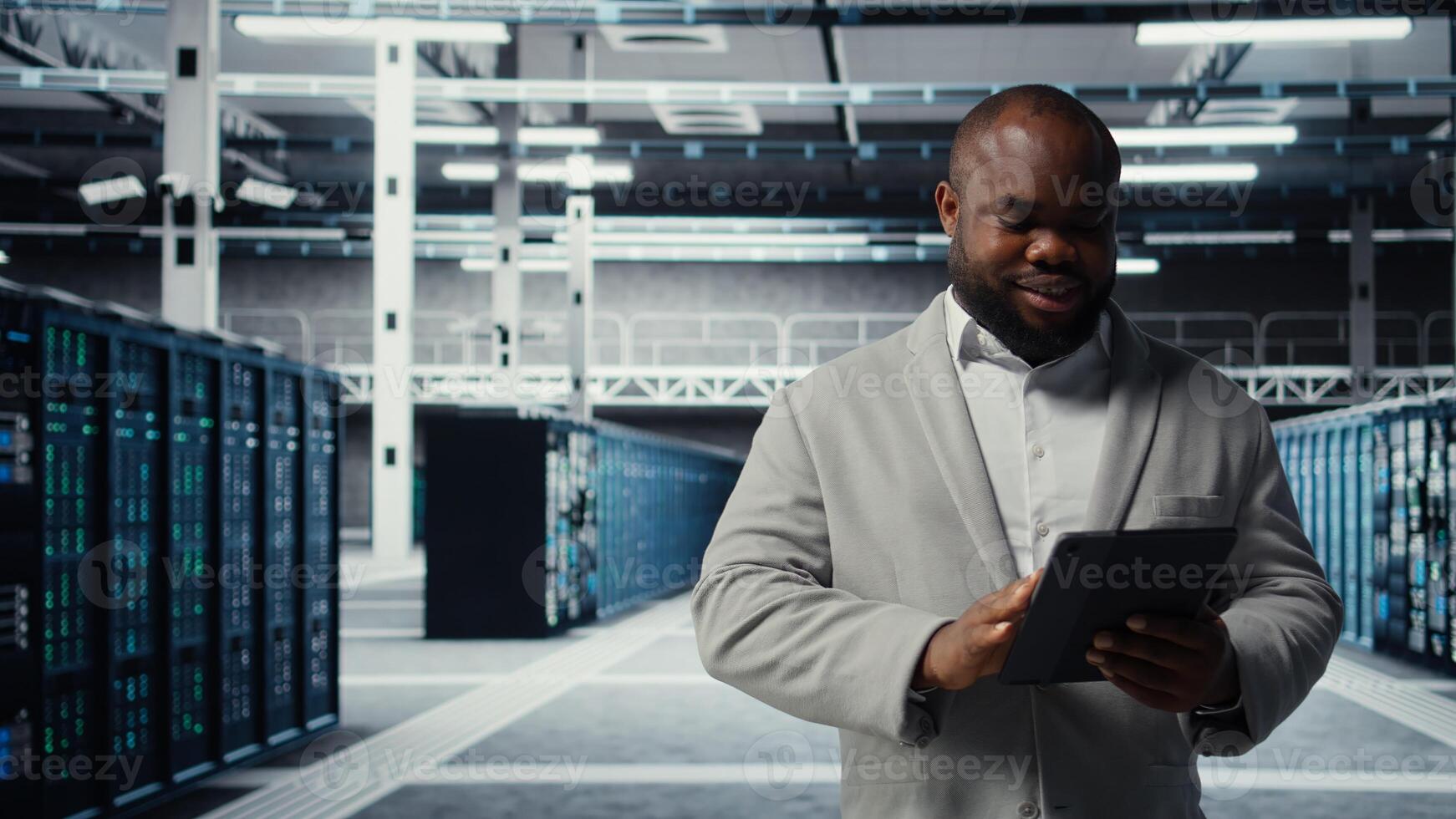 Server room worker troubleshooting server connectivity issues using software on tablet. Data center technician upgrading enterprise networks hardware using device, camera A photo