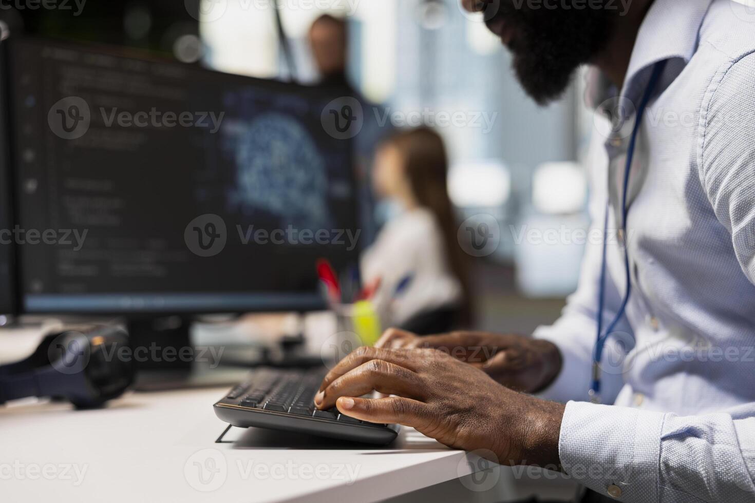 Close up of engineer typing on PC keyboard, coding with AI language model assistance. IT expert writing code, doing software development using artificial intelligence LLM assistant suggestions photo