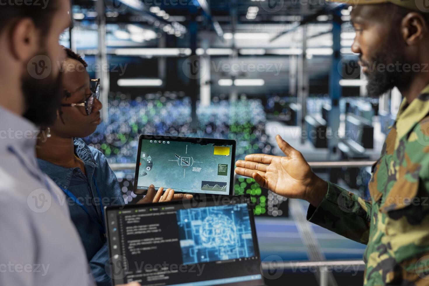 Military technicians in secure data center monitoring AI tech systems. Black army operator in server hub ensuring stable infrastructure for machine learning defense operations. photo