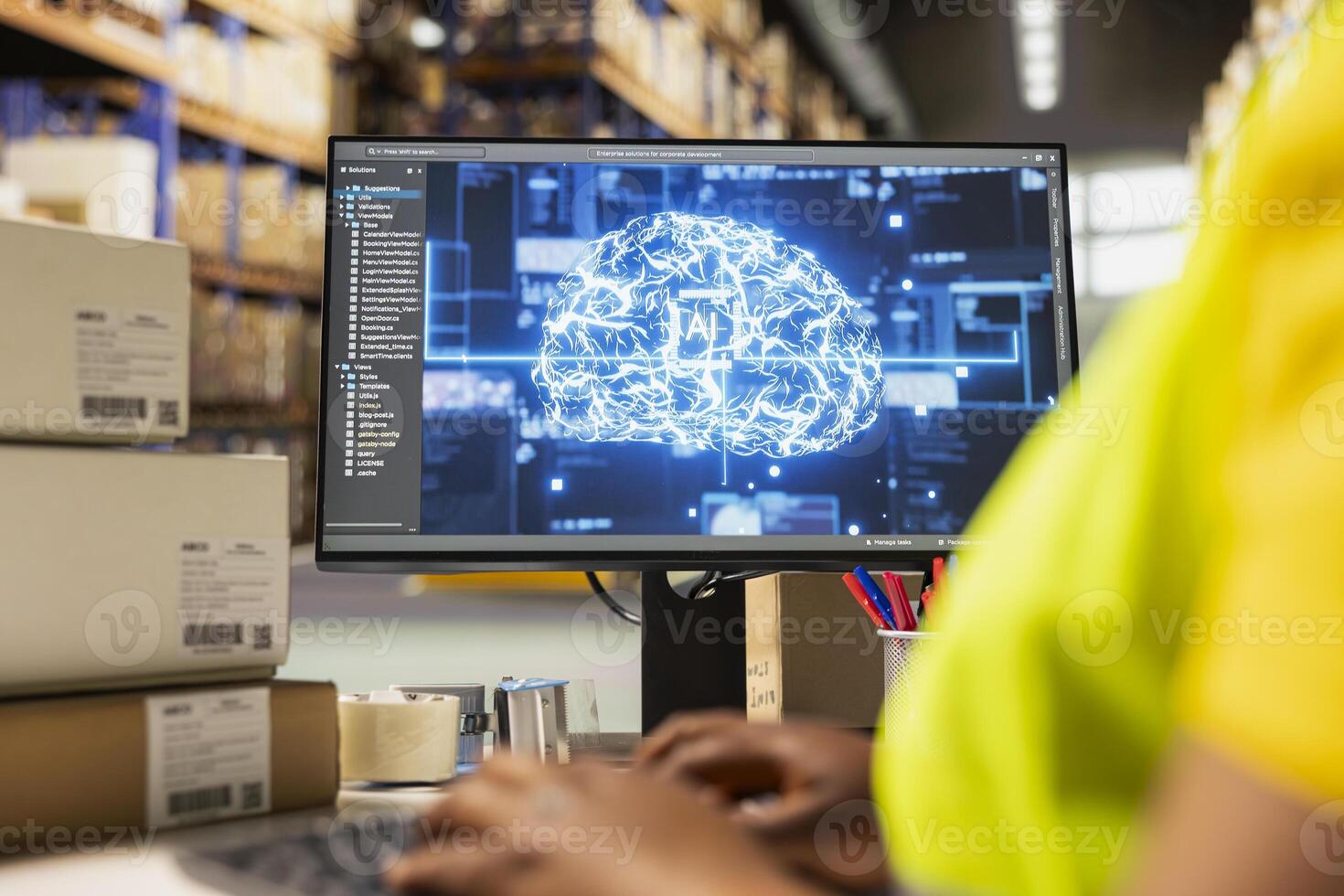 Black woman worker using AI neural network system to help with order processing, working in industrial warehouse with artificial intelligence. Parcel status monitoring for automation. photo