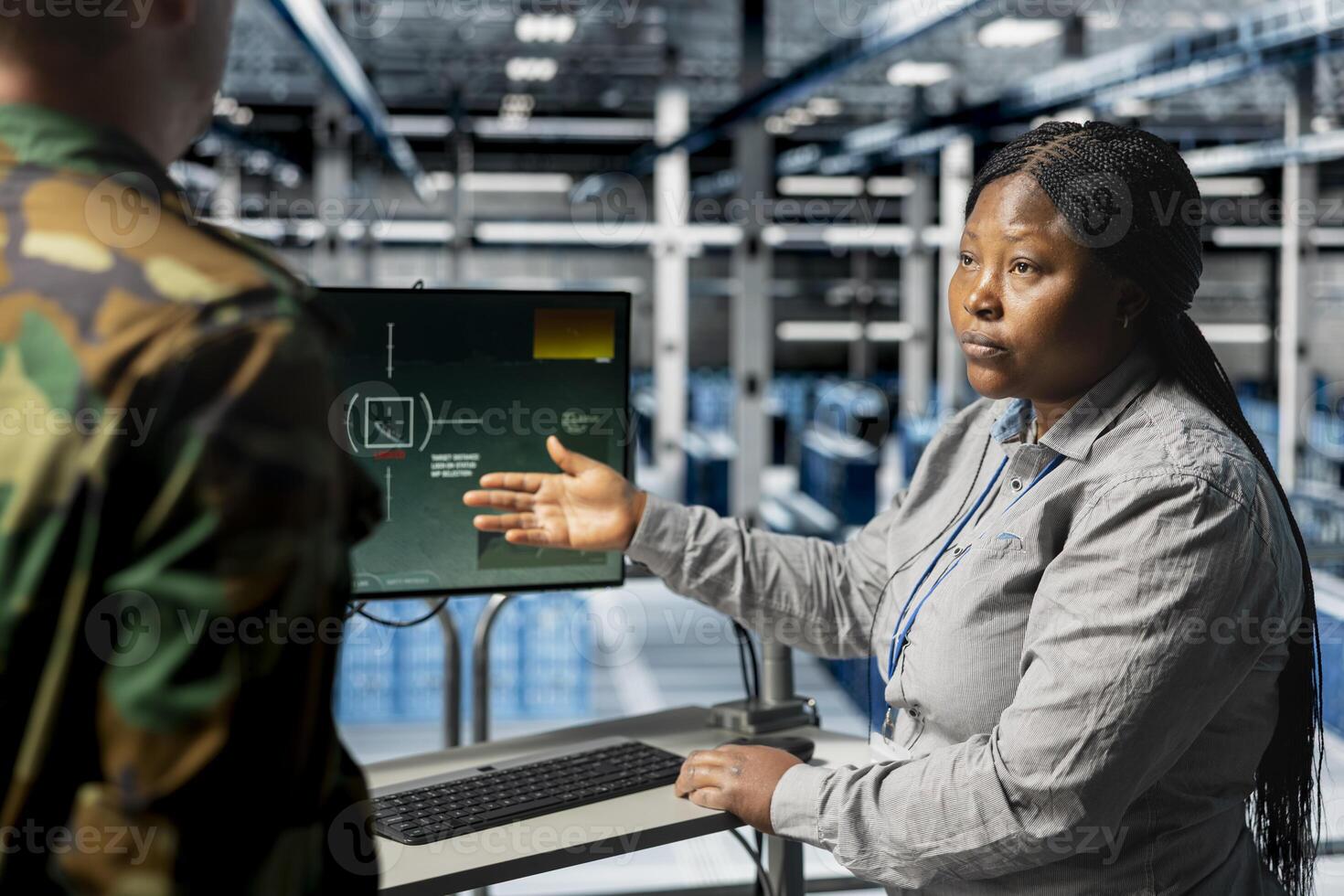 Team of military experts doing brainstorming, looking at encrypted satellite intel in data center. Teamworking army server farm colleagues extracting enemy movement data using satellite technology photo