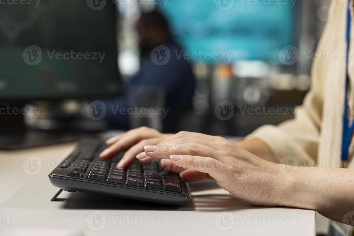 Close up of female worker leverages analytics and report writing for development and monthly performance results, utilizing digital resources and insights to ensure strategic goals achievement. photo