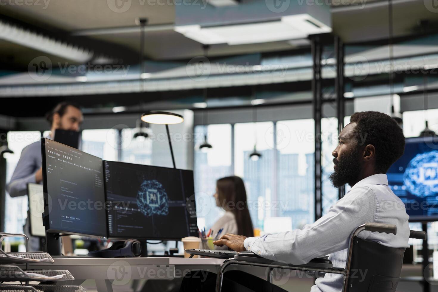 IT specialist in wheelchair developing software applications using AI automation. Programmer with paraplegia in inclusive office debugging applications with artificial intelligence photo