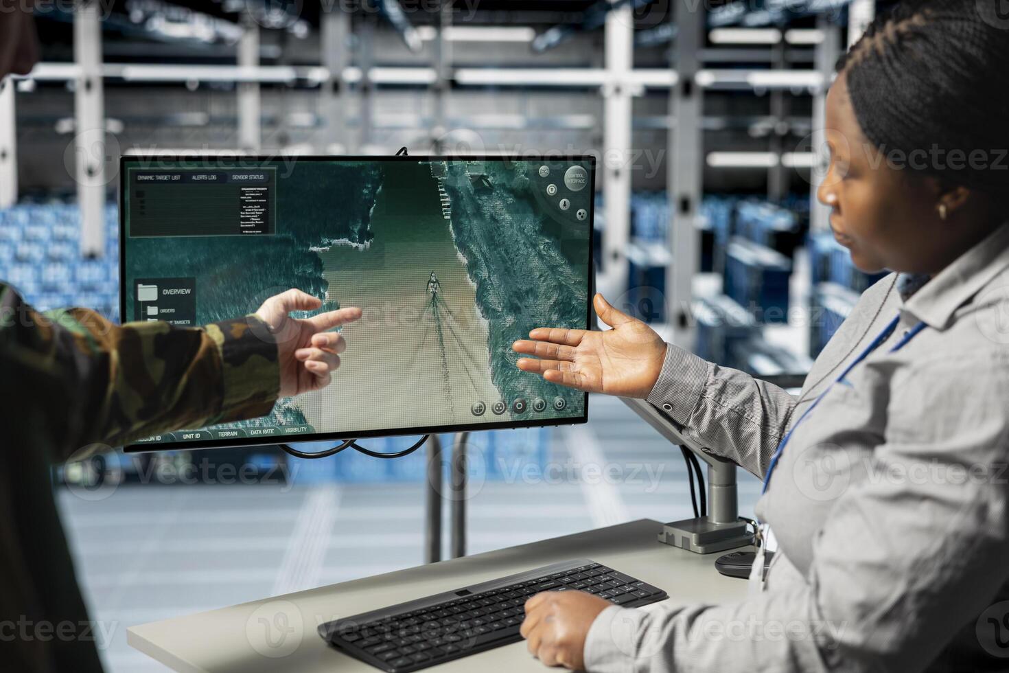 Team of military engineers in data center tracking satellite coordinates using monitor interface. Teamworking server room coworkers analyzing reconnaissance data through satellite imaging systems photo