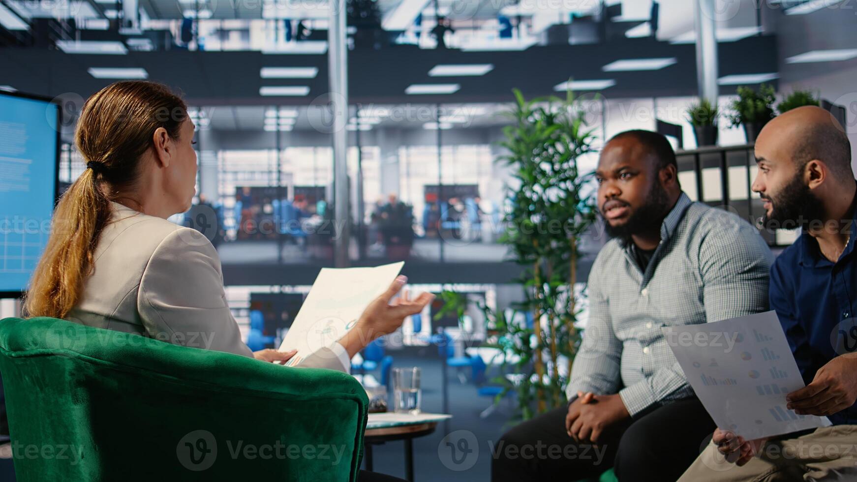 Office meeting highlighting leadership and business planning for a new partnership between powerful people using metrics and strategy to drive performance and development. Camera A. photo