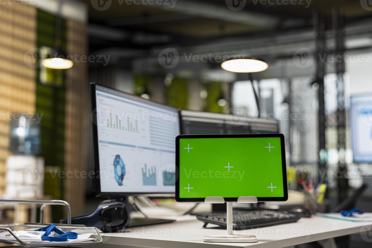 Empty company office features digital resources and copy space on tablet, space ready for report writing, strategy development and alignment of organizational objectives and goals achievement. photo