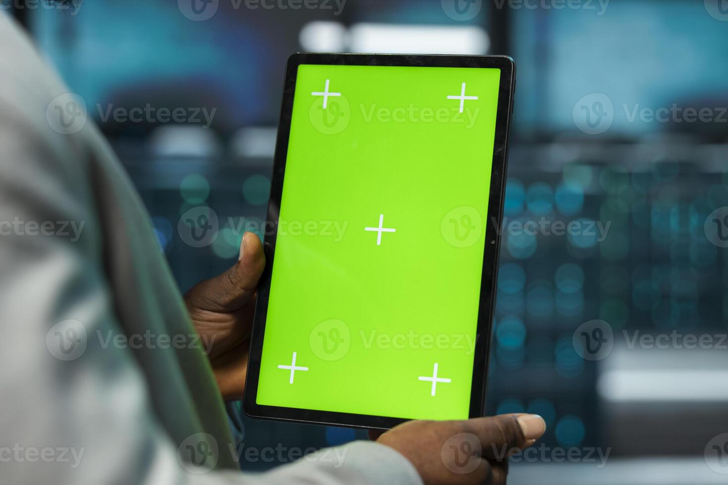 Close up of data center engineer using isolated screen tablet, managing rackmounts energy consumption. Worker using chroma key device used for automation and monitoring processes in server room photo