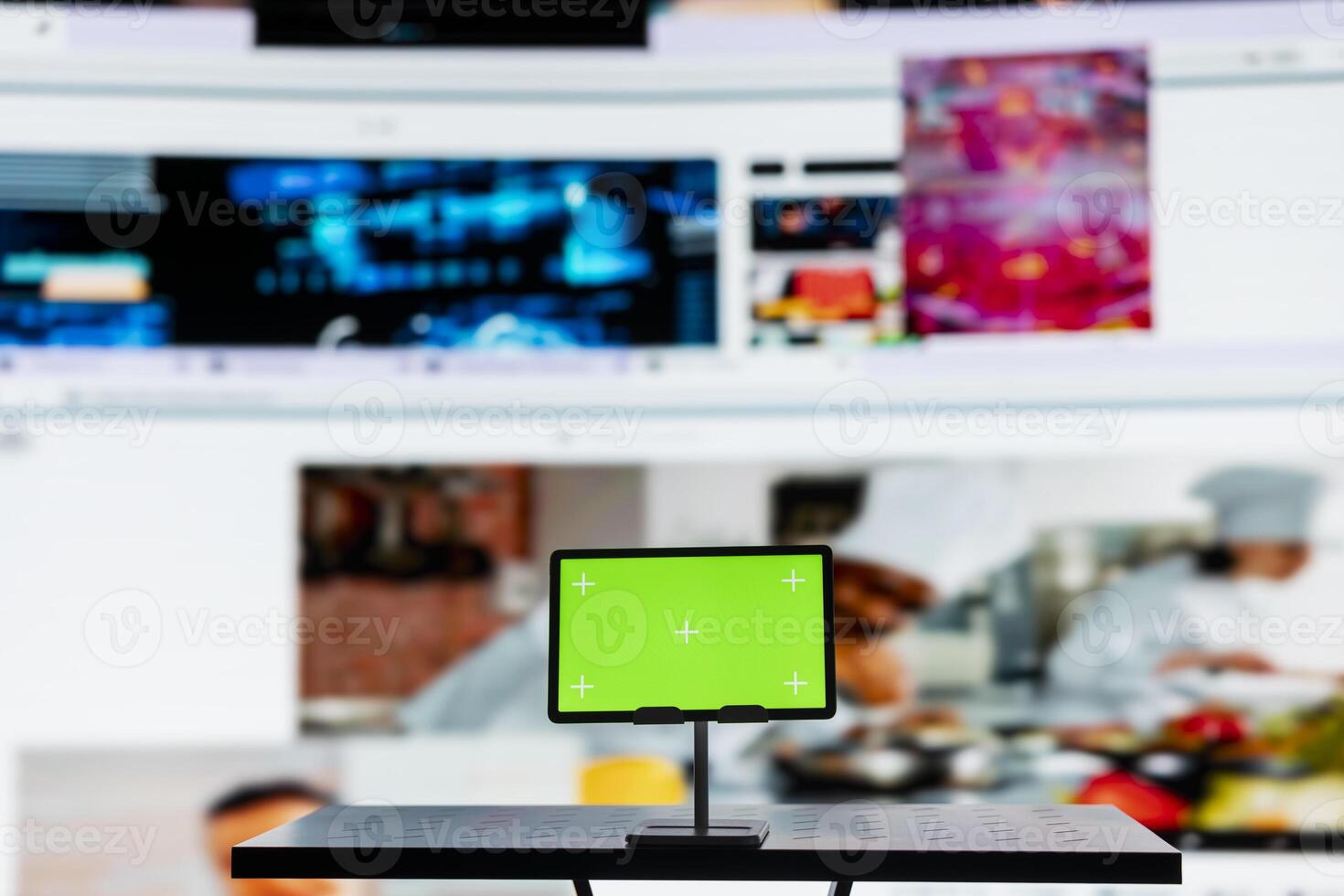 Close up of mockup tablet and distribution service dashboard. Chroma key device and videowall of trending clips showcasing popular internet media and global streaming trends photo