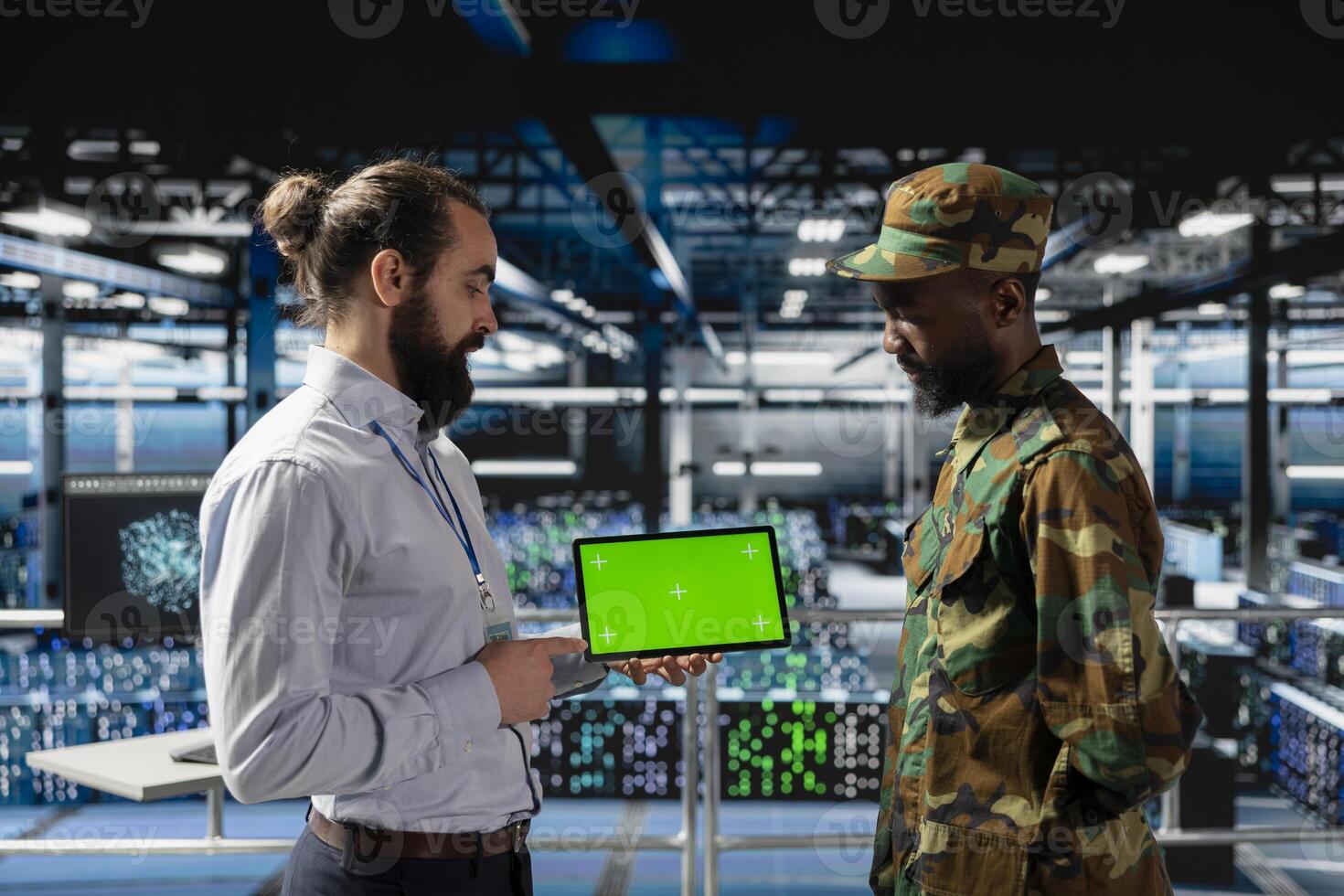 IT military engineering team using mockup display on tablet, working on national defense mission on industrial platform in control room base. Protecting networks against cyber threats. photo