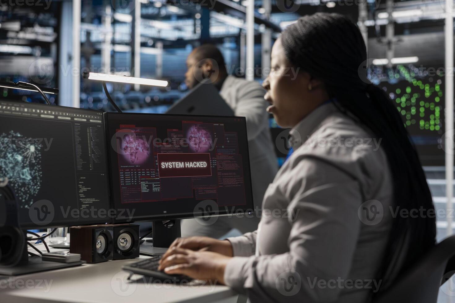 Server farm IT specialist trying to repair compromised hardware after hacker attack. Software developer in data center fighting malicious threat, initiating protocol to protect critical systems photo