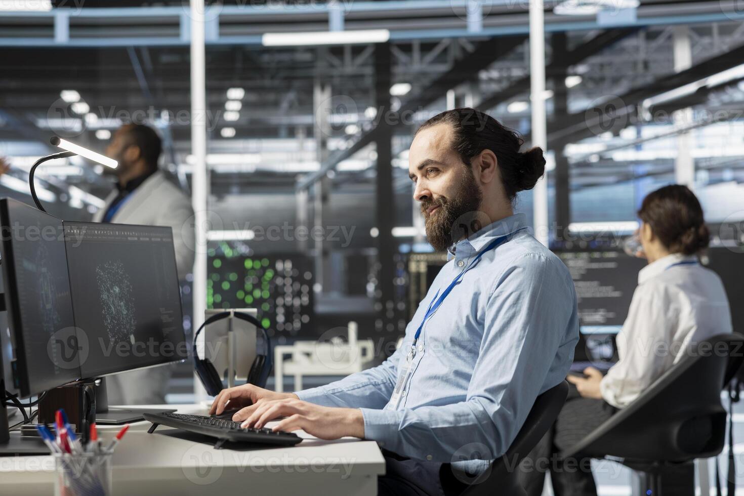 Smiling data center IT professional using artificial intelligence neural networks technology on PC. Happy server farm admin using AI programming language on computer to update hardware photo