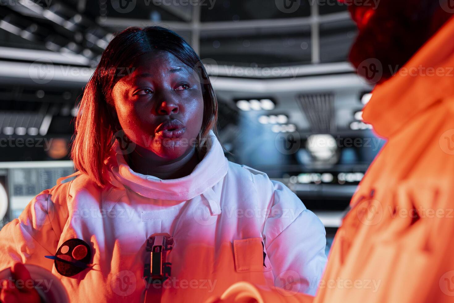 Cosmonauts doing brainstorming, reacting to red light alert flashing after asteroid impact threatening station hull. Astronauts monitor spaceship structural integrity to prevent critical failure photo