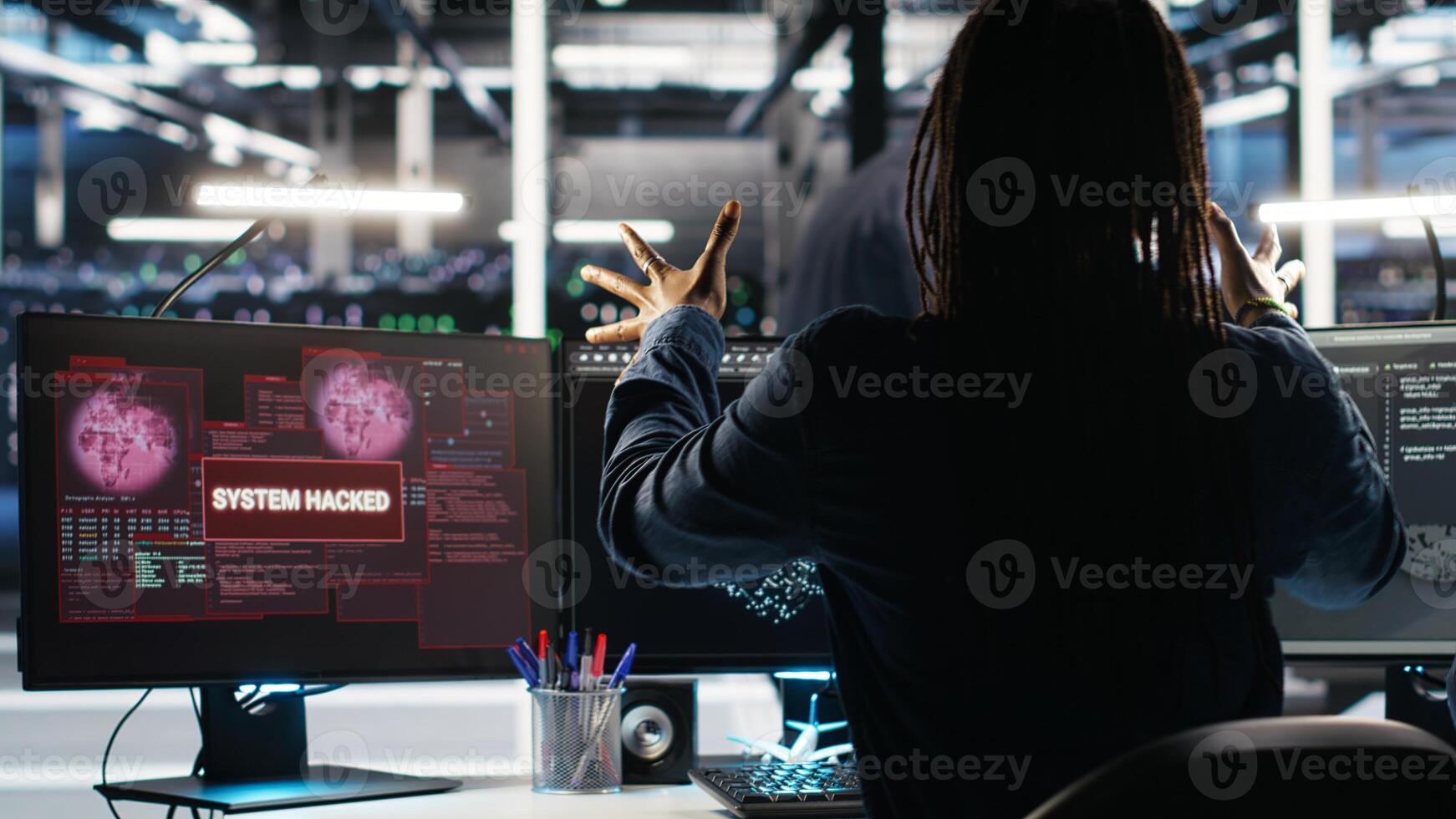 Panicked engineer in AI server facility reacts to hacking incident involving theft of sensitive data. Data center employee alarmed by computer virus triggered by security systems, camera B photo