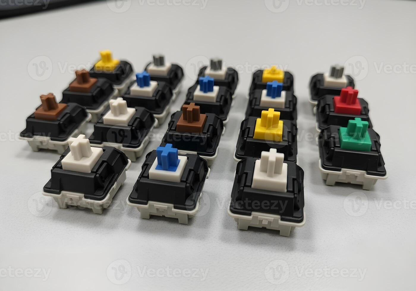Macro photo of mechanical keyboard switches removed and arranged on grid layout with clean office background and sharp clarity